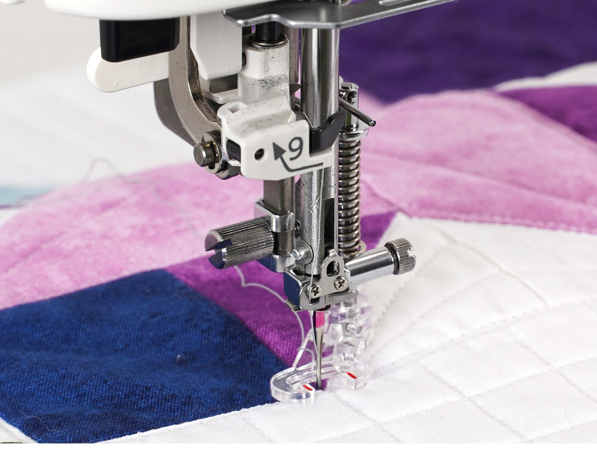 Janome Continental M6 free-motion quilting a purple quilt