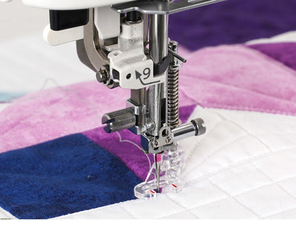 Janome Continental M6 free-motion quilting a purple quilt