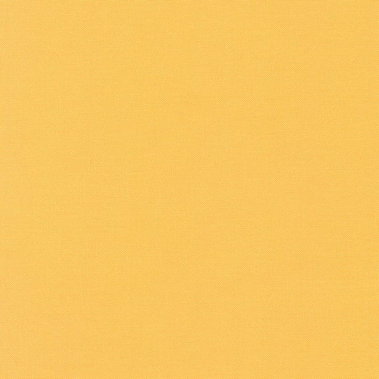 Daffodil Kona Solid Cotton by Robert Kaufman - Sold By 1/4yd