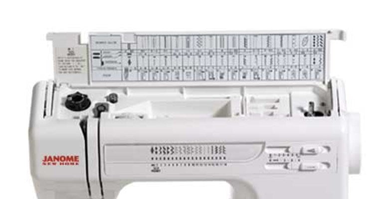 Janome HD-3000 top lid open showing the stitch reference chart